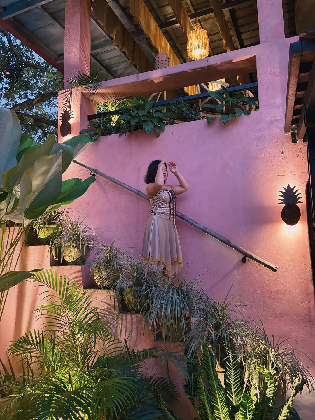 PIÑA staircase lined with pineapple motifs at dusk